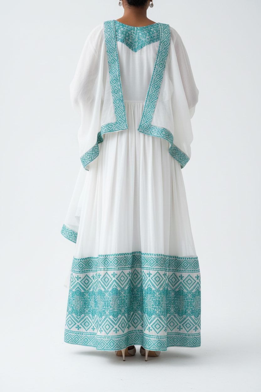 Habesha Kemis back view – white and teal embroidery