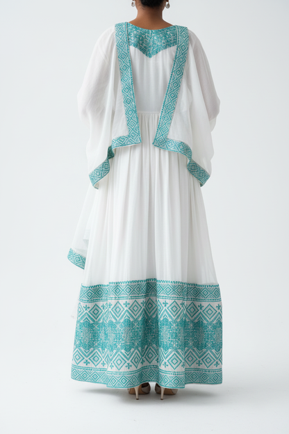 Habesha Kemis back view – white and teal embroidery