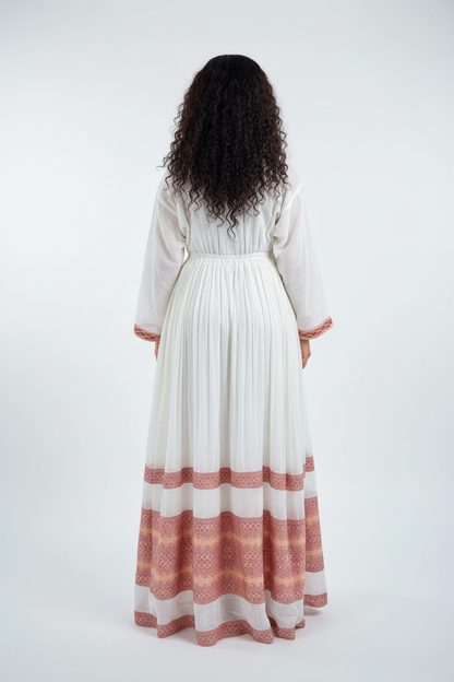 Habesha Kemis back view – white and terracotta embroidery borders