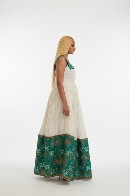 Habesha Kemis side view – white and green flared skirt